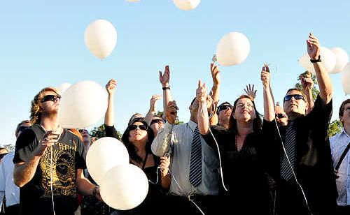 Brad Garard’s brother David (left), step-father John and mother Lesley Carlson with his father Glen Garard (right) release balloons near the site where he was killed on Sunday. Brad Garard’s brother David (left), step-father John and mother Lesley Carlson with his father Glen Garard (right) release balloons near the site where he was killed on Sunday.